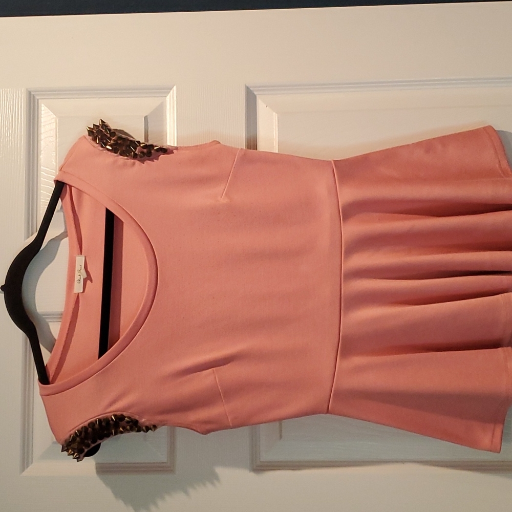 Salmon colored shirtbwith spikes on sleeves